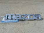 Mazda RX8 Boot Lid Badge New F151-51-710B. Fixed Price $28.69.