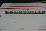 1962 Bonneville Chrome Fender Side Emblem Gold Toned 541368. Fixed Price $85.00.