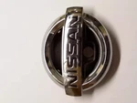 Genuine Nissan Emblem Front 62890-1VX0A. Fixed Price $66.71.
