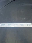 Genuine Land Rover Atlas Hatch Emblem MY2013-22 Range LR038709. Fixed Price $136.00.