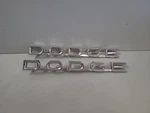 1958-60 Dodge Truck Emblem #1780007 Mopar Script Oem Set Of 2. Fixed Price $129.00.
