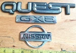 Nissan Quest Gxe Circa '96 Emblems F3XA 1243829 Aa / 16B621 1243518 Ba 1853. Fixed Price $8.00.