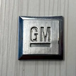 Gm Mark Of Excellence Emblem Badge Logo 1 Inch Square Oem 86498784 Chrome. Fixed Price $5.99.