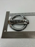 02-04 Nissan Xterra Front Chrome Emblem Logo Badge Symbol Oem 7S2. Fixed Price $19.99.