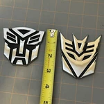 Transformers Autobots Decepticon Emblems Open-box. Fixed Price $12.99.