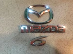 09-12 Mazda 6 Emblem Rear Trunk Logo Nameplate Genuine P# 9M81-5443828-AA. Fixed Price $27.95.