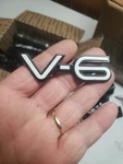 1990'S Pontiac Grand V-6 Nameplate Emblem Badge White Black. Fixed Price $10.00.
