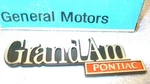 1973-76 Pontiac Grand Name Plate Gm# 1700920/ 9657700/ 9658570. Fixed Price $75.00.