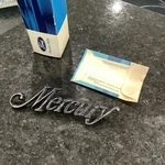 Nos 1975 Mercury Deck Lid Name Plate D54Y-6642528-A. Fixed Price $45.00.