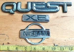 Nissan Quest Xe Circa '96 Emblems F3XA 1243829 Aa / 16B621 1243518 Ba 1854. Fixed Price $8.00.