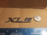 2008-2011 Toyota Camry Xle Emblem. Fixed Price $8.00.