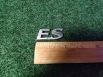 2004-2007 Mitsubishi Lancer " Es Emblem Trunk Nameplate Badge Chrome Oem 5S1. Fixed Price $18.99.