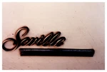 1980S Close Up "seville" Emblem Badge On White Cadillac Car Body Vintage Photo. Fixed Price $19.39.