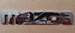 Mazda YL84-7843500-BA Tribute Tailgate Emblem. Oem Used. Refurbished 01/06. Fixed Price $10.00.