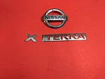 2005-2012 Nissan Xterra Rear Lid Trunk Gate Emblem Logo Badge Oem. Fixed Price $30.00.