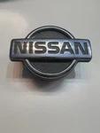Nissan D21 Front Grill Emblem. Fixed Price $62.00.