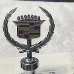 1988,91 Cadillac Eldorado, Seville Hood Ornament Emblem Brougham Oem. Fixed Price $150.00.