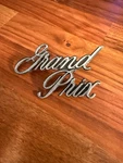 Pontiac Grand Prix Script Emblem L-7000 #498675 1970-1979 Oem Badge. Fixed Price $22.95.