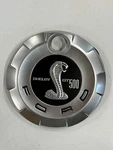Mustang 2007-2009 Shelby GT500 Faux Gas Fuel Filler Door Cap / Emblem Oem. Fixed Price $100.00.