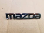 Mazda Oem 2002 2003 Protege Rear Hatch Emblem Badge Logo Nameplate B25R 51 710. Fixed Price $17.99.