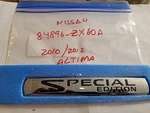 Nissan 84896-ZX60A. Trunk Lid Emblem. Used Oem. Refurbished. 2011/1012 Altima. Fixed Price $10.00.