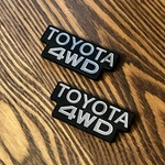 Reproduction 84-88 Toyota 4WD B-pillar Badges Emblems Left And Right Set Pair. Fixed Price $110.00.