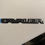 1988-1990 Chevy Rear End Panel "cavalier" Emblem G.M.#20717278. Fixed Price $22.00.