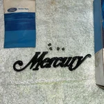 1973 Mercury Script Emblem Name Plate D3MY-16604-A With Mounting Screws. Fixed Price $32.00.