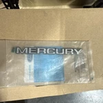 84-87 Mercury Topaz Adhesive Nameplate Script Nos E66Y-8C270-A. Fixed Price $30.00.