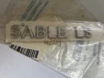 Genuine Ford Nameplate 4F4Z-5442528-BA. " Sable Ls. Fixed Price $19.99.