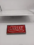 * Nos Oem Ford Lariat Emblem E0TB-10280C82-A. Fixed Price $85.00.