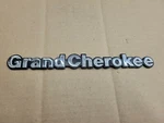 Jeep Oem 1993-1998 Grand Cherokee Chrome Fender Emblem Badge Logo Name 85501-G. Fixed Price $14.99.