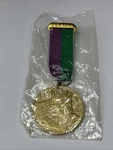 1977 Rex Brushed Gold Aluminum Band Badge Original Wrapper. Fixed Price $10.00.