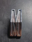 1964 Mercury Comet Rear Quarter Pnl Letter "m" Emblem C4GB-6229255-C. Fixed Price $65.00.