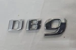 Genuine Aston Martin DB9 Rear Badge 4G43-001B40-BA. Fixed Price $125.00.