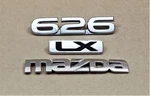 Mazda 626 & Lx Trunk Emblems Oem (3 Pieces). Fixed Price $19.96.