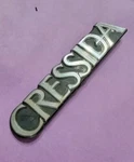 BIN9 Used 85-88 Toyota Cressida Trunk Emblem Logo 75441-22100 D12 Plastic. Fixed Price $14.99.