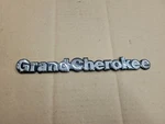 Jeep Oem 1993-1998 Grand Cherokee Chrome Fender Emblem Badge Logo Name 85501-G. Fixed Price $12.99.