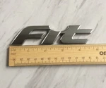 Oem 2007 Honda Fit Rear Hatch Lift Gate Lid Emblem Logo Badge. Fixed Price $14.99.