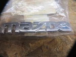 Mazda Oem # GK2A-51-711 New Emblem Ornament " Chrome Plastic. Fixed Price $39.88.