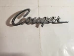 Original 1971 To 1973 Mercury Cougar Metal Script Emblem D1WB-16B114-A Qty. Fixed Price $50.00.
