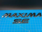 Nissan Maxima Rear Trunk Emblems Oem 84894 84896 Badge Set Fits 2000-2003. Fixed Price $21.99.