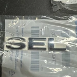 Ford 7T4Z-7842528-C Lift Gate Nameplate 2007-2014 Edge. Fixed Price $15.00.