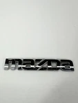 Mazda Emblem Badge Logo Nameplate Oem 855951781. Fixed Price $9.09.