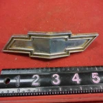 Original 1970 Chevy Grille Logo Emblem #6262300 Assy. Fixed Price $25.00.
