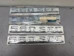 Nos Mercedes Benz 560 Sec Trunk Emblem Oem A1268172415. Fixed Price $560.00.