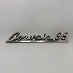 1961-64 CORVAIR-95 Original Lh Emblem Name Plate Badge 3784665 W/ Studs. Fixed Price $47.50.
