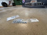 (2) Genuine Nissan Nameplate 84896-ET00A Same As Dealership. Fixed Price $74.04.