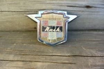 55-56 Nash Front Emblem 25546. Fixed Price $65.00.